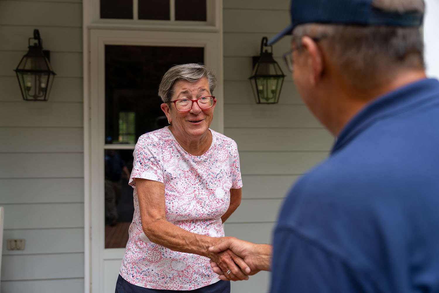 happy customer shaking hands with a Blumont Energy service technician