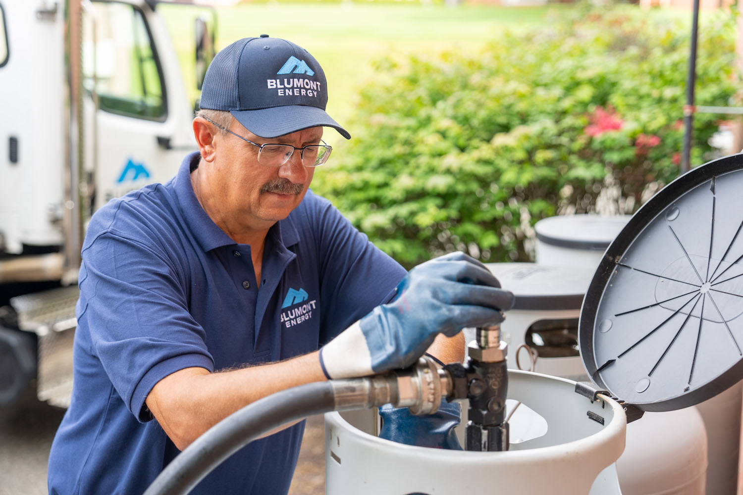 Blumont Energy employee filling a propane tank