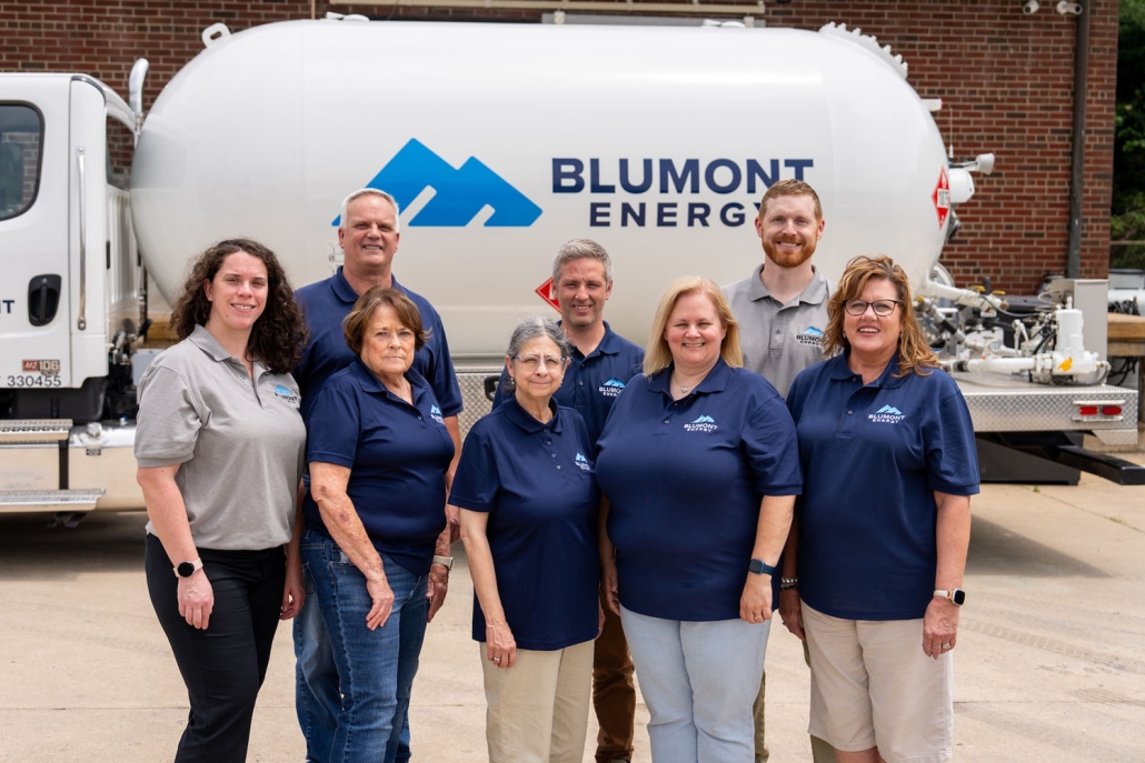 team photo of the customer service team in front of a propane truck
