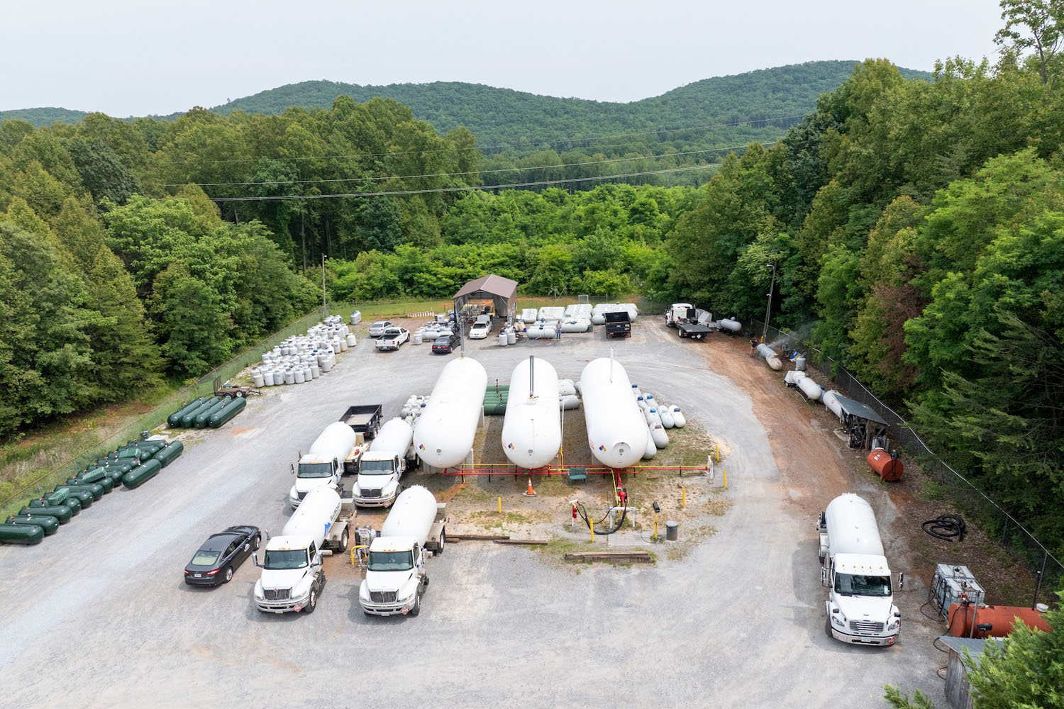 aerial view of a fueling station with propane trucks and tanks