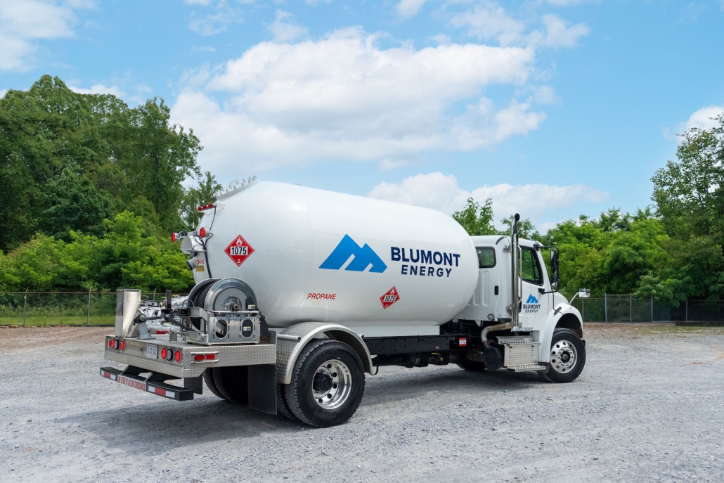 propane truck in a gravel parking lot